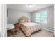 Cozy bedroom with a comfortable bed, desk, chair, and natural light from the window at 3075 Milford Sw, Marietta, GA 30008