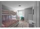 Bright bedroom with bunk beds, a desk, and a polka dot rug offering a comfortable space at 3075 Milford Sw, Marietta, GA 30008
