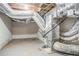 Unfinished basement utility area with exposed ductwork and concrete floor at 3920 Stonewall Tell Rd, Atlanta, GA 30349