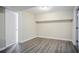 Finished basement with wood flooring, bright lighting, and neutral colored walls at 3920 Stonewall Tell Rd, Atlanta, GA 30349