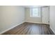 Finished basement featuring durable wood flooring and bright, neutral paint at 3920 Stonewall Tell Rd, Atlanta, GA 30349