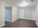 Finished basement featuring durable wood flooring, neutral paint, and a closet at 3920 Stonewall Tell Rd, Atlanta, GA 30349