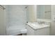 Updated bathroom featuring tile surround in the shower and granite countertop at 3920 Stonewall Tell Rd, Atlanta, GA 30349