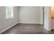 Bright bedroom featuring hardwood floors and closet at 3920 Stonewall Tell Rd, Atlanta, GA 30349