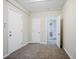 This room features neutral walls, carpeted flooring, and multiple access doors at 3920 Stonewall Tell Rd, Atlanta, GA 30349