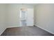 Bedroom with neutral paint, carpeted floors, and view of the hallway at 3920 Stonewall Tell Rd, Atlanta, GA 30349