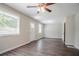 Bright living room with windows allowing natural light and beautiful wood flooring at 3920 Stonewall Tell Rd, Atlanta, GA 30349