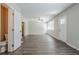 Spacious living room with new hardwood floors, fan and neutral paint colors at 3920 Stonewall Tell Rd, Atlanta, GA 30349