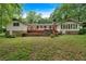 The backyard has a spacious deck and hot tub perfect for entertaining and relaxation at 450 S Susan Creek Dr, Stone Mountain, GA 30083