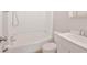 Bright bathroom with a shower-tub combo and modern white vanity sink at 450 S Susan Creek Dr, Stone Mountain, GA 30083