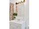 Updated bathroom with modern vanity, framed mirror, and attractive lighting at 450 S Susan Creek Dr, Stone Mountain, GA 30083