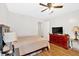 Bedroom features wood-look flooring, natural light, closet, and neutral decor at 450 S Susan Creek Dr, Stone Mountain, GA 30083
