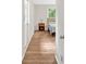 A cozy bedroom with door to the outside, wood-look floors, and a side table at 450 S Susan Creek Dr, Stone Mountain, GA 30083