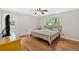 Comfortable bedroom featuring wood-look floors, neutral walls, and a window at 450 S Susan Creek Dr, Stone Mountain, GA 30083