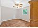 This bedroom features a ceiling fan, natural light, and wood-look flooring at 450 S Susan Creek Dr, Stone Mountain, GA 30083