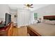 Bedroom features wood-look flooring, natural light, closet, and neutral decor at 450 S Susan Creek Dr, Stone Mountain, GA 30083