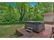 Relax in this backyard hot tub surrounded by nature and mature trees at 450 S Susan Creek Dr, Stone Mountain, GA 30083