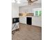 Bright kitchen features white cabinets, modern appliances, and stylish tile backsplash at 450 S Susan Creek Dr, Stone Mountain, GA 30083