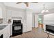 Bright kitchen features white cabinets, modern appliances, and stylish tile backsplash at 450 S Susan Creek Dr, Stone Mountain, GA 30083