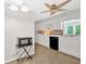 Bright kitchen features white cabinets, modern appliances, and stylish tile backsplash at 450 S Susan Creek Dr, Stone Mountain, GA 30083