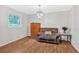 Warm and inviting living area with a large window, hardwood floors, and a stylish chandelier at 450 S Susan Creek Dr, Stone Mountain, GA 30083