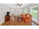Cozy living room with plenty of natural light, laminate flooring, and comfortable furnishings at 450 S Susan Creek Dr, Stone Mountain, GA 30083