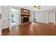 Spacious living room features a brick fireplace and access to the sunroom at 450 S Susan Creek Dr, Stone Mountain, GA 30083