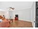 Bright living room with laminate floors, featuring a ceiling fan and ample natural light at 450 S Susan Creek Dr, Stone Mountain, GA 30083