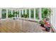 Sunroom filled with plants and natural light, perfect for relaxation or entertaining at 450 S Susan Creek Dr, Stone Mountain, GA 30083