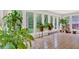 Inviting sunroom with walls of windows providing scenic outdoor views at 450 S Susan Creek Dr, Stone Mountain, GA 30083