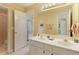 Bathroom featuring double sinks, an open view to other rooms, and a large mirror at 935 Brookline Way, Alpharetta, GA 30022