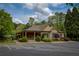 Attractive clubhouse exterior with stone and siding, a covered entrance, and accessible parking spaces at 935 Brookline Way, Alpharetta, GA 30022