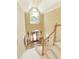 Grand foyer with soaring ceilings, large windows, and a staircase leading to the upper level at 935 Brookline Way, Alpharetta, GA 30022