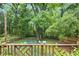 Backyard shot from the porch, includes a fire pit, chairs, and a wooden fence at 1091 Napier Se St, Atlanta, GA 30316