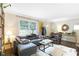 Inviting living room with a sectional sofa, accent chair, and natural light at 1091 Napier Se St, Atlanta, GA 30316