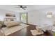 Sun-filled main bedroom featuring hardwood floors, and a cozy sitting area at 1995 Raleigh Tavern Dr, Roswell, GA 30076