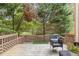 Wooden deck overlooking a green backyard with mature trees and peaceful scenery at 1995 Raleigh Tavern Dr, Roswell, GA 30076