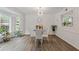Bright dining area featuring a modern chandelier and beautiful bay window at 1995 Raleigh Tavern Dr, Roswell, GA 30076