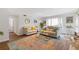 Bright living room with modern decor, neutral paint, hardwood floors, and bay window at 1995 Raleigh Tavern Dr, Roswell, GA 30076