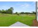 Expansive backyard featuring lush green grass and mature trees offers serene outdoor living and entertaining at 210 Sharon Ln, Loganville, GA 30052