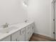 Bathroom featuring double sink vanity, and sleek hardware at 210 Sharon Ln, Loganville, GA 30052
