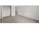 Bedroom with plush carpet, a large window, and a closet at 210 Sharon Ln, Loganville, GA 30052