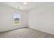 Well-lit bedroom with plush carpeting, a modern ceiling fan and a bright window at 210 Sharon Ln, Loganville, GA 30052