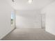 Bright, spacious bedroom with plush carpeting and a large window at 210 Sharon Ln, Loganville, GA 30052