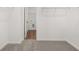 Spacious walk-in closet with wire shelving and plush carpeting at 210 Sharon Ln, Loganville, GA 30052