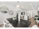 Open floor plan featuring dining area connected to the bright kitchen with white cabinets at 210 Sharon Ln, Loganville, GA 30052
