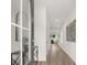 Open and airy entryway with light wood floors, modern decor, and contemporary artwork at 210 Sharon Ln, Loganville, GA 30052