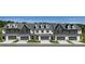 Beautiful townhomes featuring two-car garages and craftsman-style architectural details at 210 Sharon Ln, Loganville, GA 30052