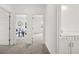 Upstairs hallway with open doorways and neutral carpet leading to various rooms at 210 Sharon Ln, Loganville, GA 30052