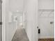 Bright hallway with carpet and white walls leads to various rooms and storage areas at 210 Sharon Ln, Loganville, GA 30052